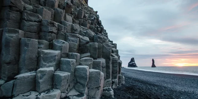 Amazing landscape with basalt rock formations Troll Toes on black beach Reynisfjara near the village of Vik