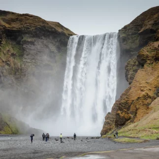 Clean water of famous Iceland waterfalls on a stony rocky mountain landscape