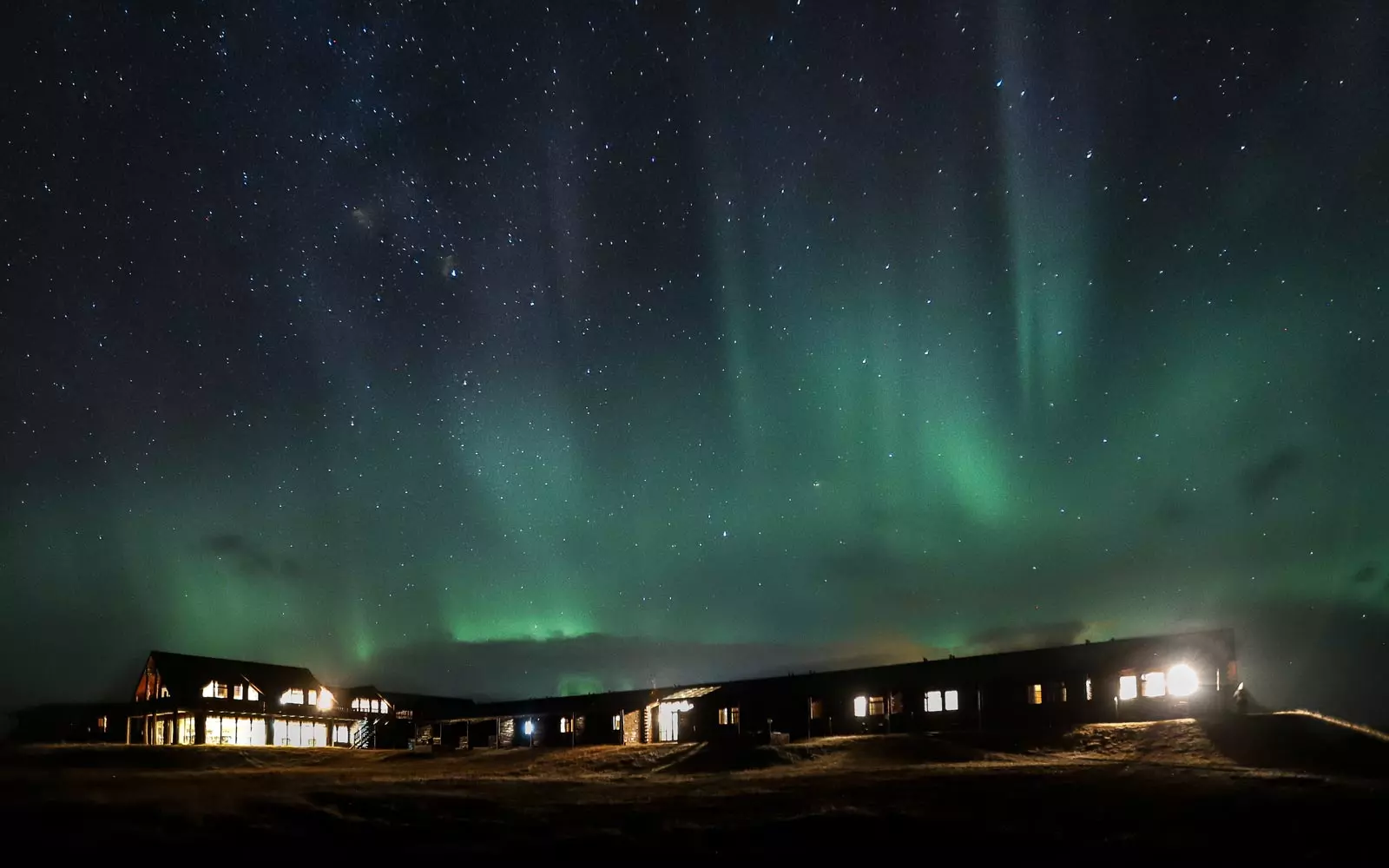 Hella hotel in Iceland beneath northern lights