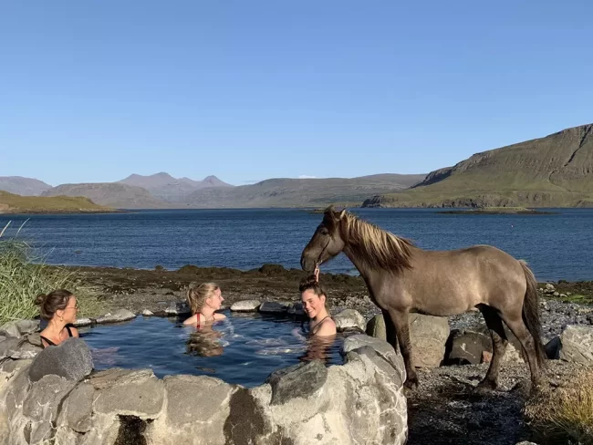 Mr Iceland - guests having a warm bath during a horseback ride in summer